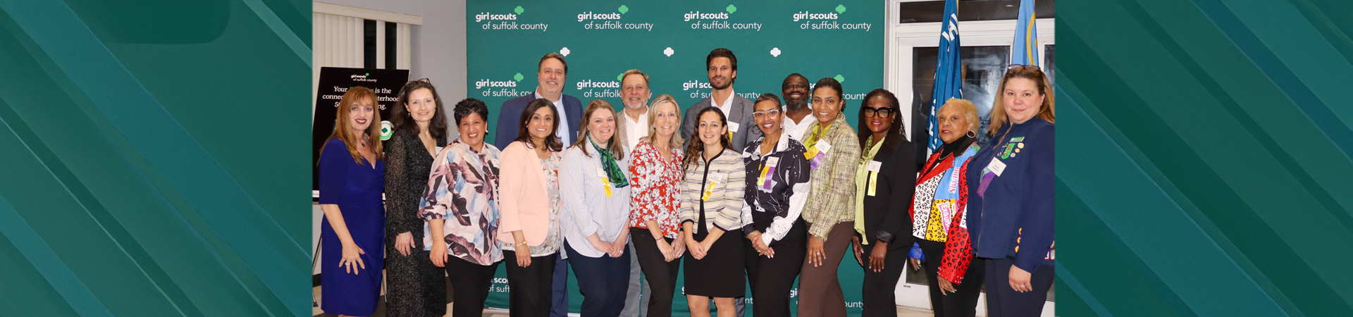  girl scout staff or volunteer wearing adult vest in woods smiling 